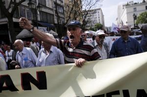 A Greek pensioner shouts slogans during a demonstration for better healthcare in Athens
